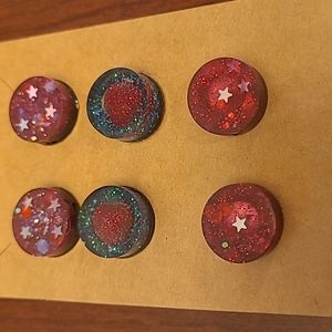 3 glittery pairs of stud earrings in different styles